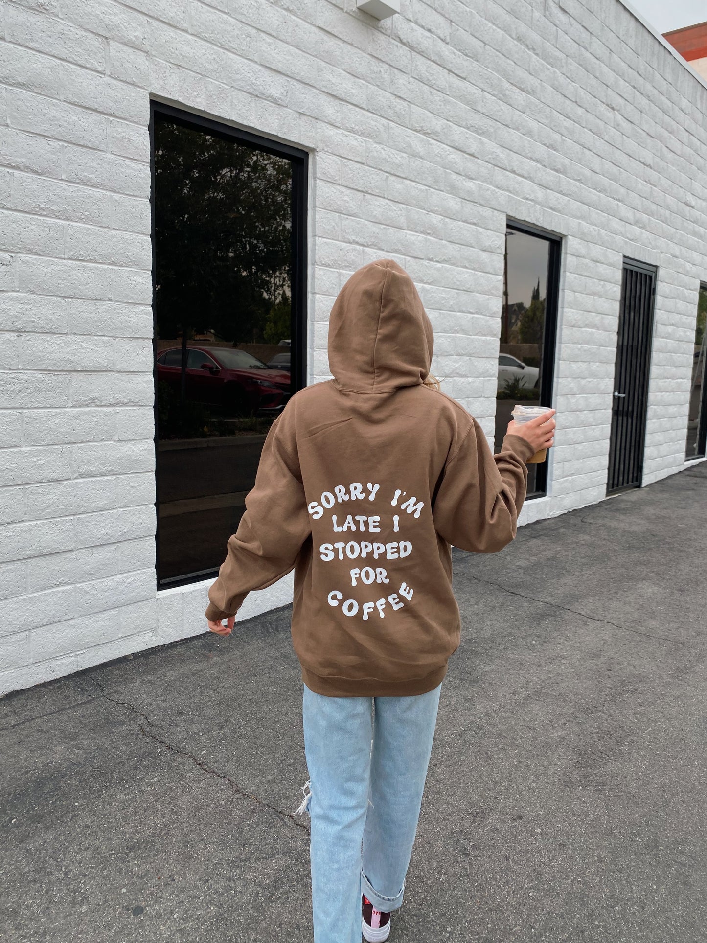 brown "SORRY I'M LATE I STOPPED FOR COFFEE" hoodie