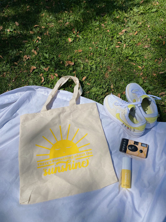 yellow "there's something about the sunshine" tote bag