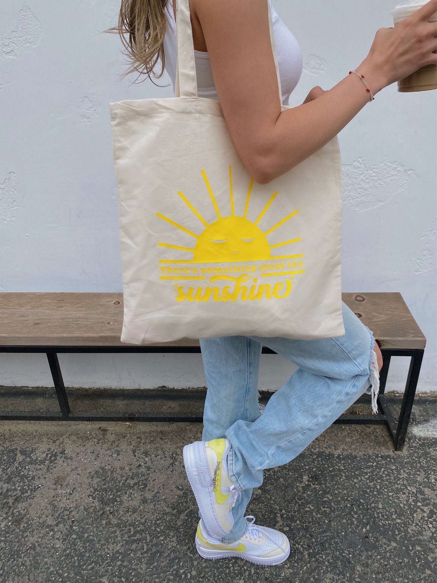 yellow "there's something about the sunshine" tote bag